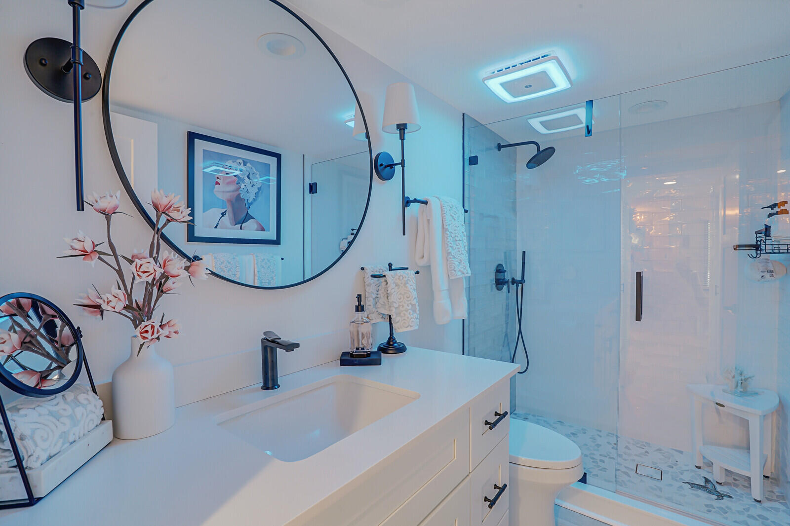 7527 Glendevon Lane, Unit 805 Delray Beach, FL 33446 - Photo 28 of 52 a bathroom with a sink a toilet and a mirror