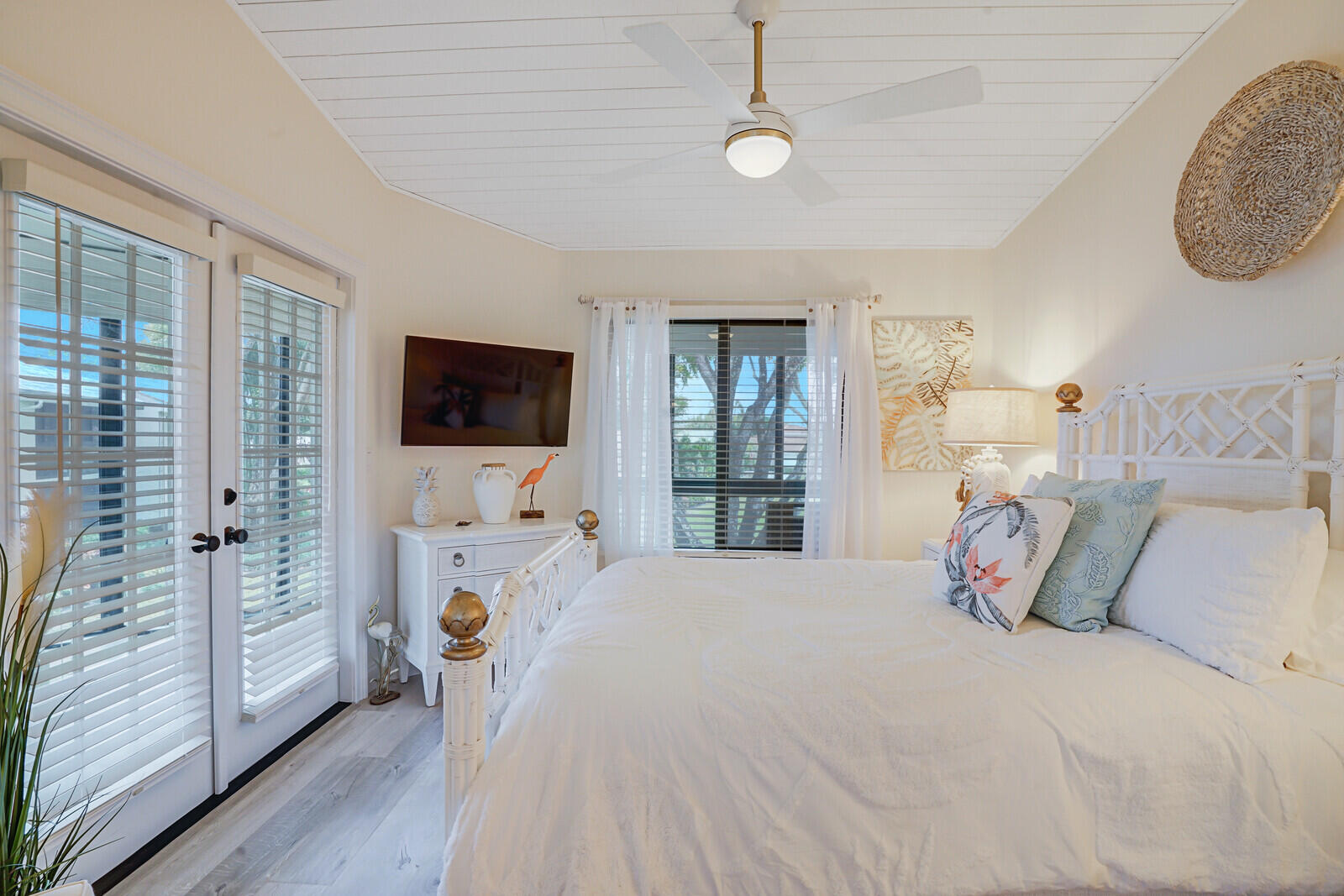 7527 Glendevon Lane, Unit 805 Delray Beach, FL 33446 - Photo 30 of 52 a bedroom with a bed and a flat tv screen on dresser