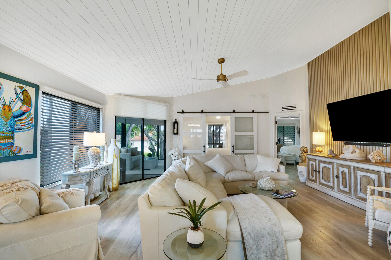 7527 Glendevon Lane, Unit 805 Delray Beach, FL 33446 - Photo 5 of 52 a living room with furniture and a flat screen tv