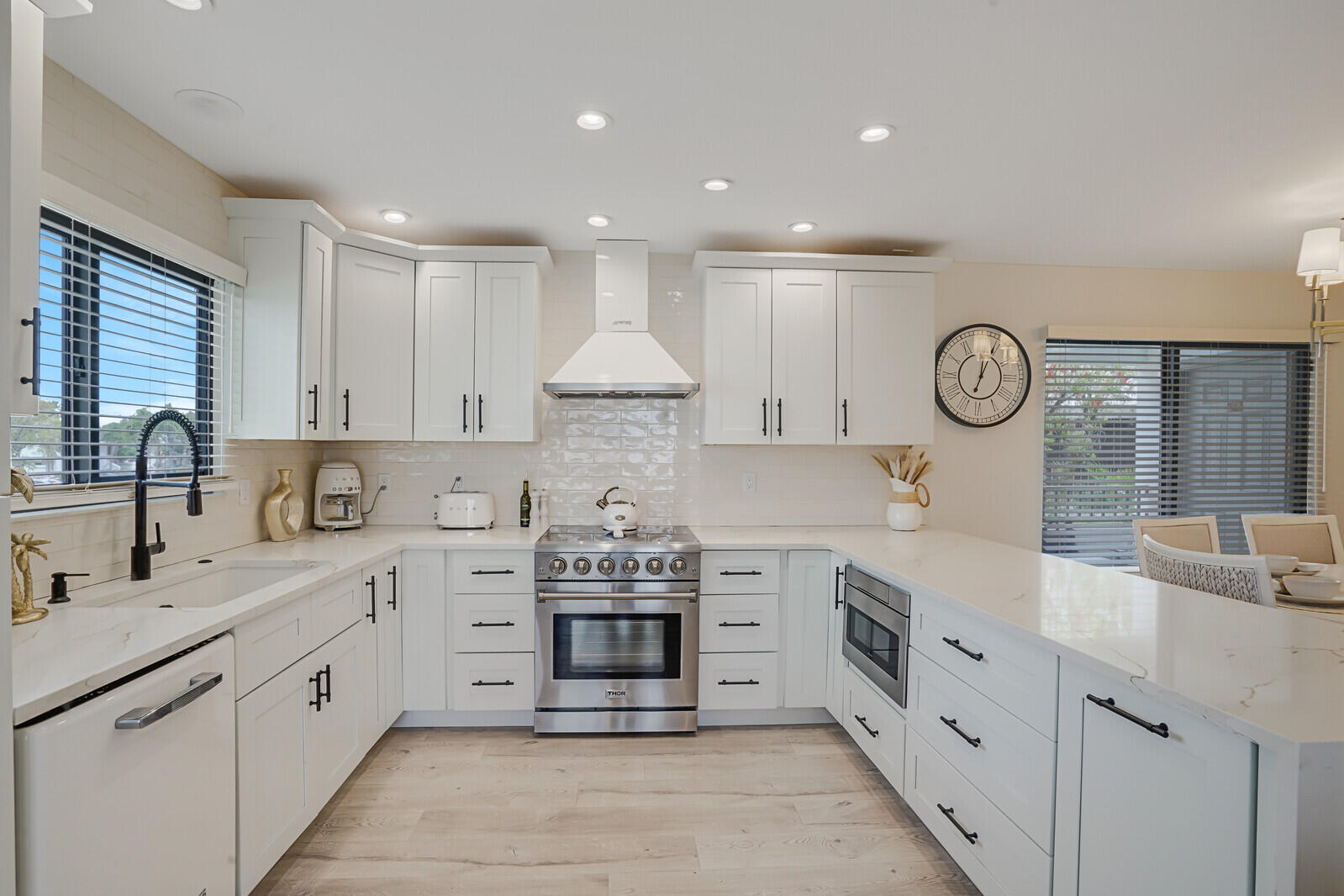 7527 Glendevon Lane, Unit 805 Delray Beach, FL 33446 - Photo 7 of 52 a large kitchen with stainless steel appliances granite countertop a sink and a stove