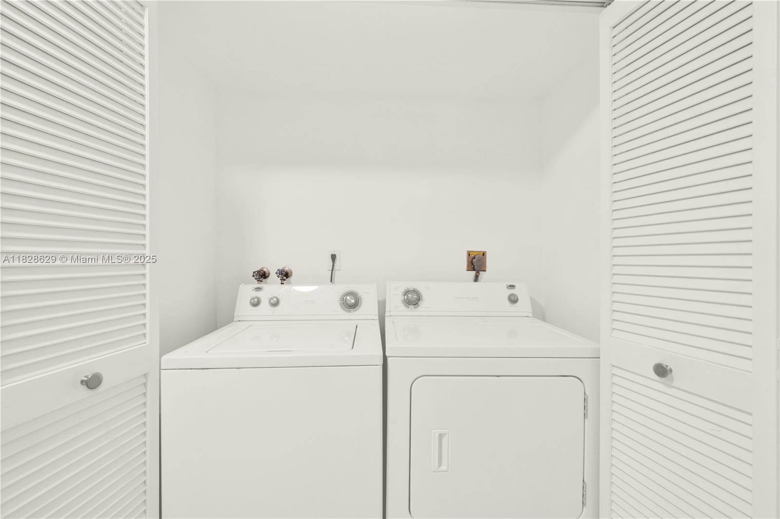 3200 North Course Lane, Unit 216 Pompano Beach, FL 33069 - Photo 14 of 36 a utility room with dryer and washer