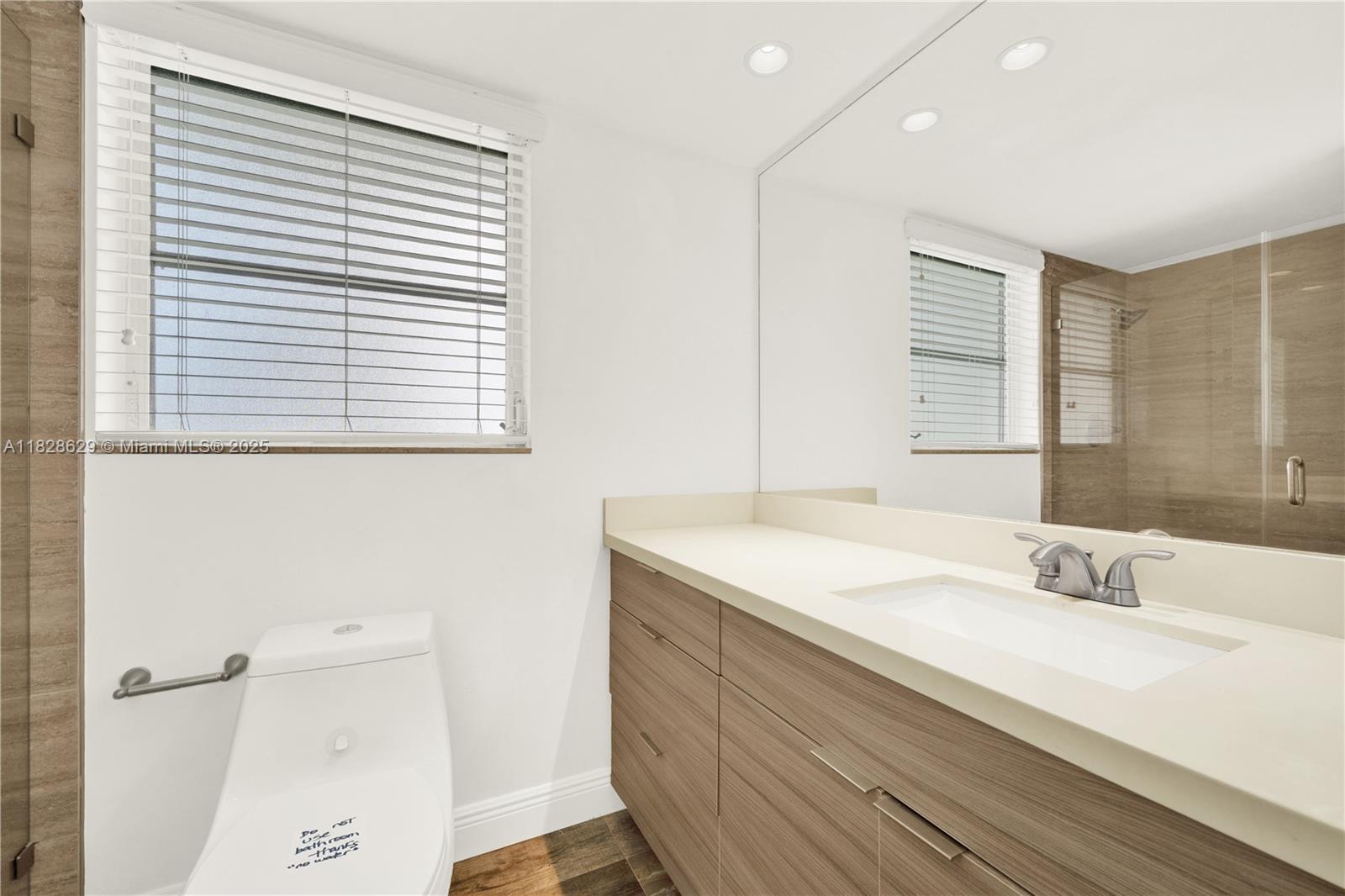 3200 North Course Lane, Unit 216 Pompano Beach, FL 33069 - Photo 24 of 36 a bathroom with a sink and a bathtub