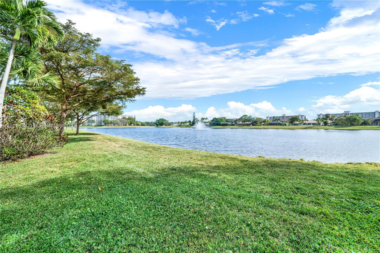 3200 North Course Lane, Unit 216 Pompano Beach, FL 33069 - Photo 5 of 36 a view of yard with swimming pool and green space