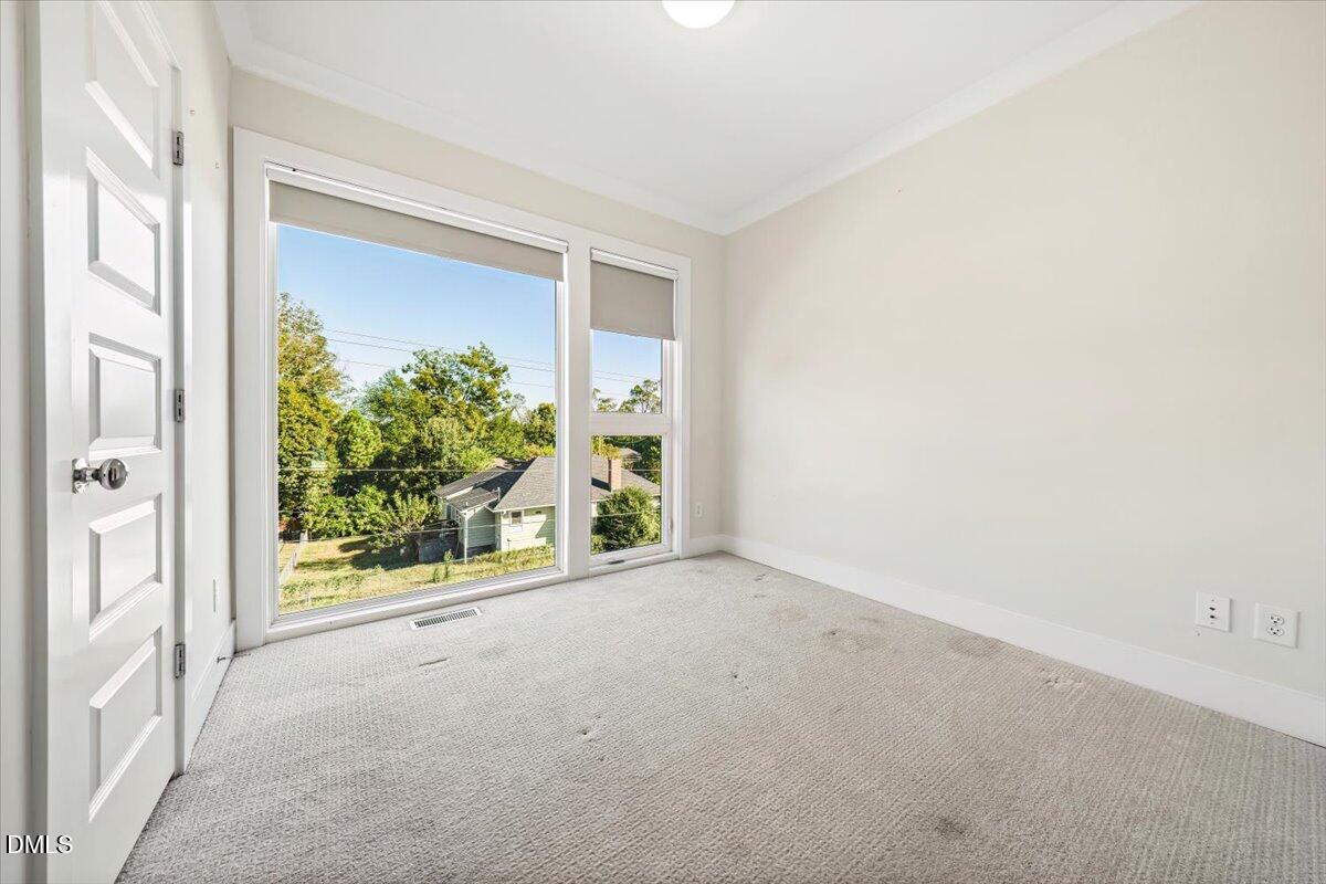 712 East Edenton Street, Unit 102 Raleigh, NC 27601 - Photo 15 of 29 a view of a room with a large window