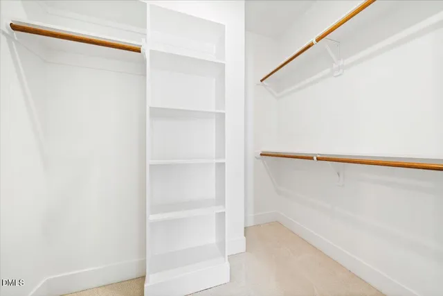 a view of an empty walk in closet