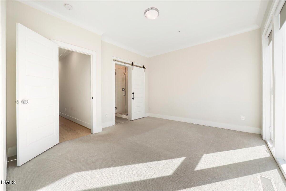 712 East Edenton Street, Unit 102 Raleigh, NC 27601 - Photo 21 of 29 a view of an empty room