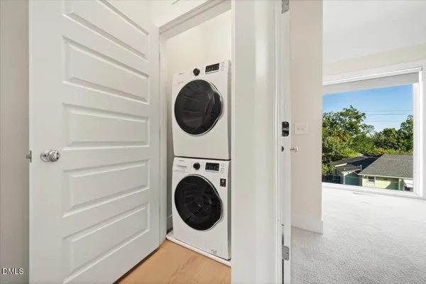 a view of a house with potted plants