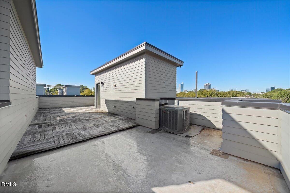 712 East Edenton Street, Unit 102 Raleigh, NC 27601 - Photo 28 of 29 a view of a house with a backyard