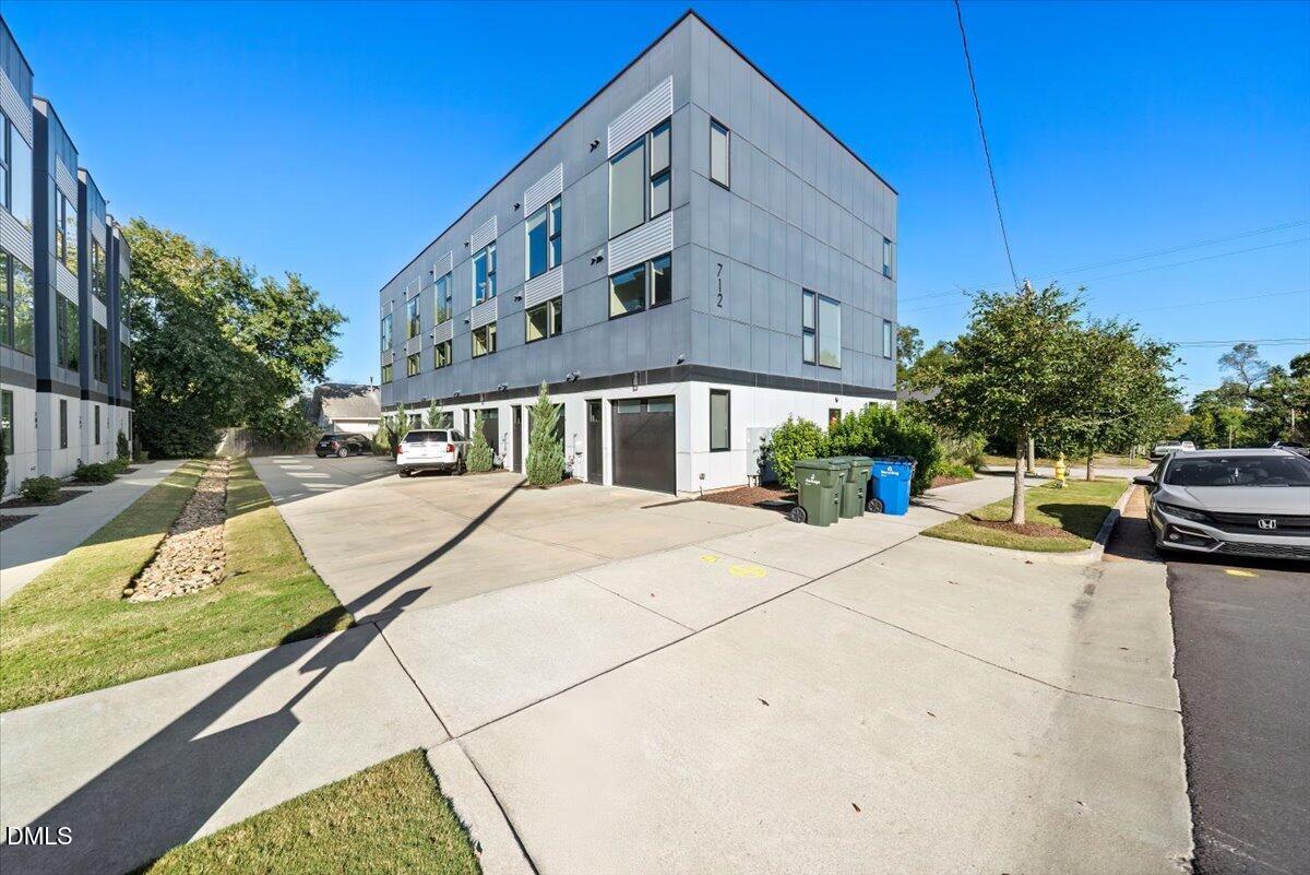 712 East Edenton Street, Unit 102 Raleigh, NC 27601 - Photo 3 of 29 a view of a patio with couches and potted plants