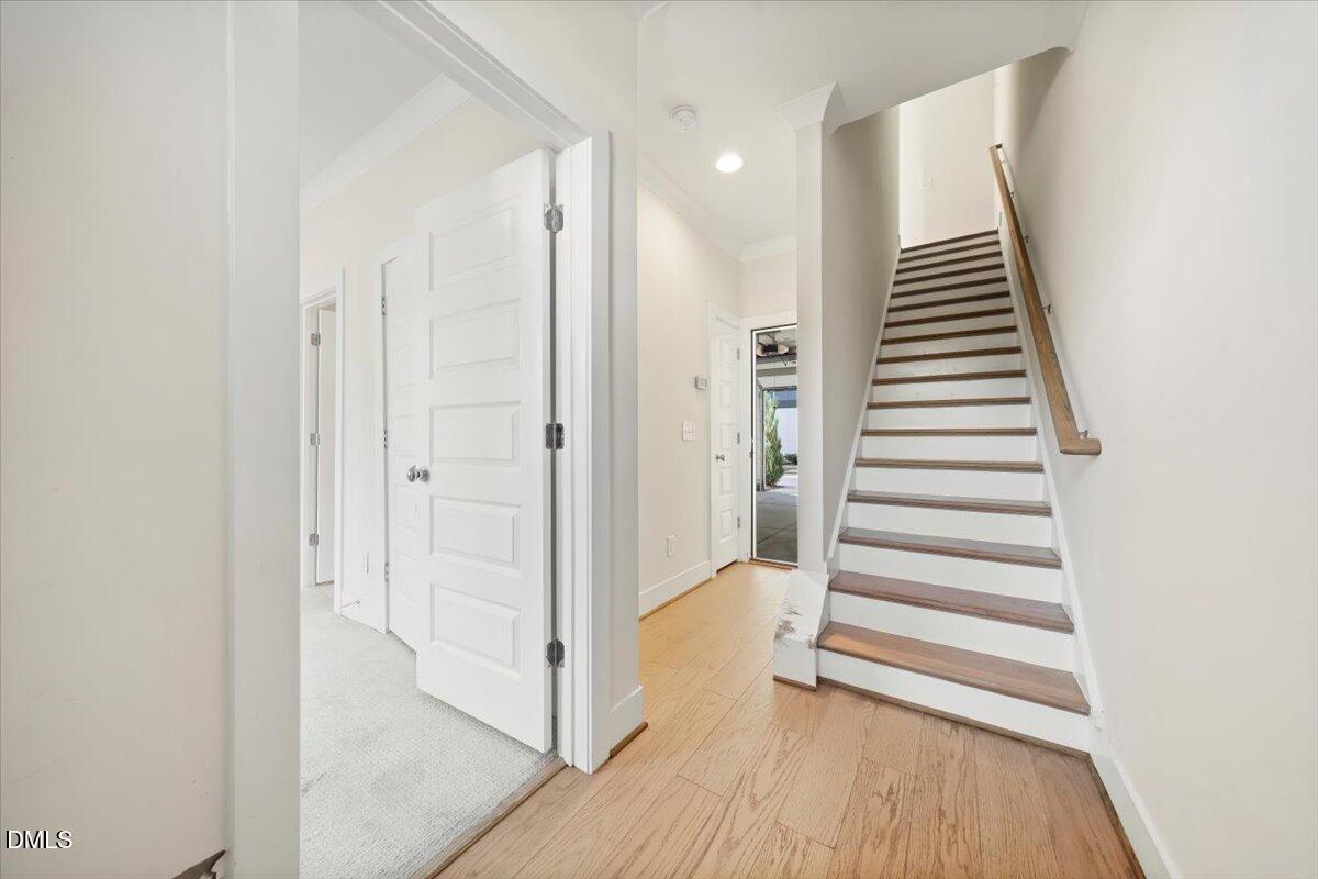 712 East Edenton Street, Unit 102 Raleigh, NC 27601 - Photo 6 of 29 a view of a hallway with entryway and wooden floor
