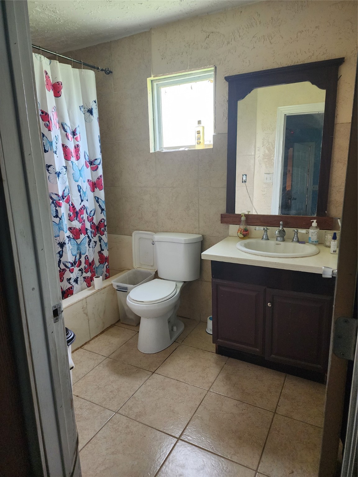 6815 Beard Road Needville, TX 77461 - Photo 14 of 30 a bathroom with a toilet sink and mirror
