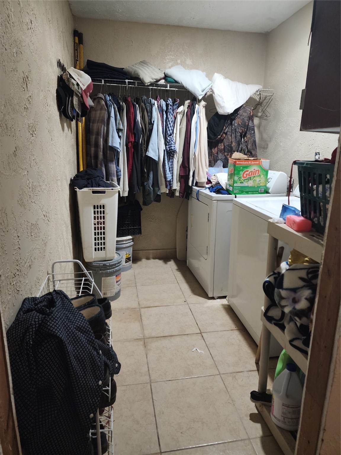 6815 Beard Road Needville, TX 77461 - Photo 15 of 30 a view of walk in closet with clothes and shoes