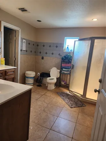 a living room with furniture a window and a flat screen tv