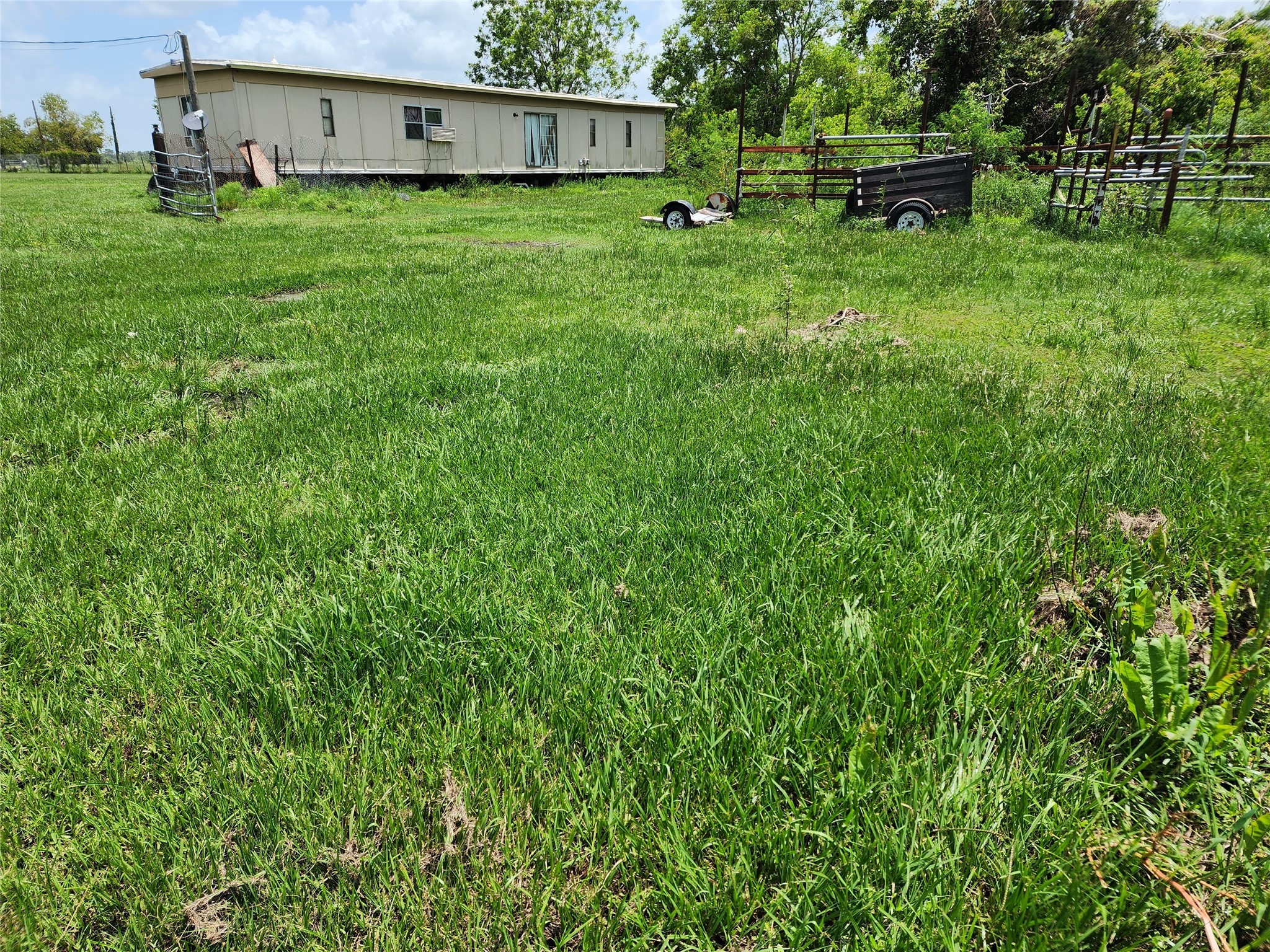 6815 Beard Road Needville, TX 77461 - Photo 28 of 30 a view of a house with a back yard