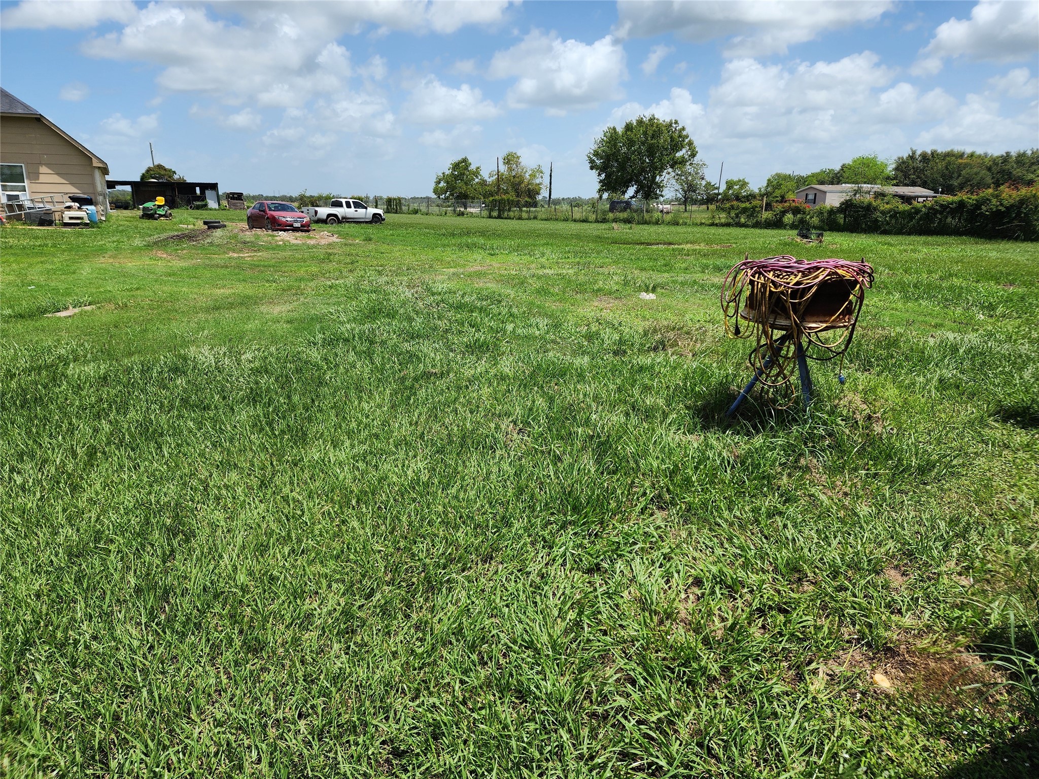 6815 Beard Road Needville, TX 77461 - Photo 29 of 30 a backyard of a house with lots of green space