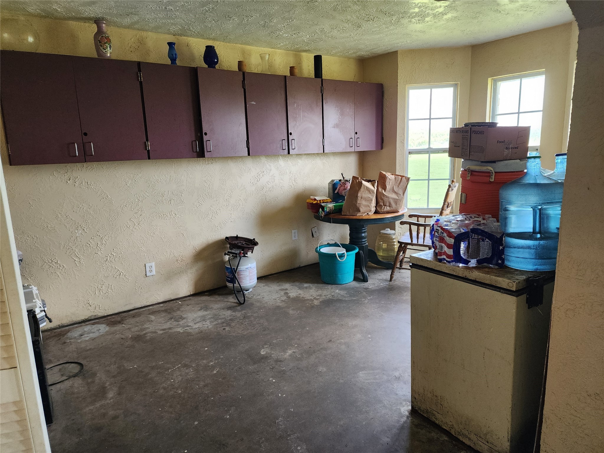 6815 Beard Road Needville, TX 77461 - Photo 8 of 30 a kitchen with a sink and a cabinets