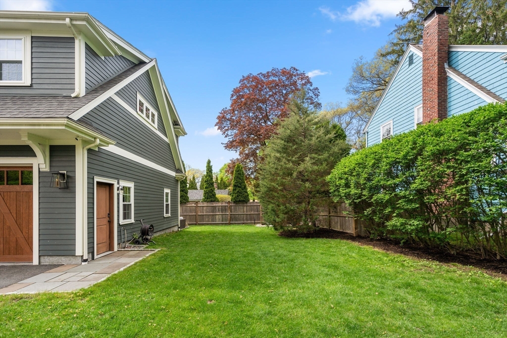 59 Avon Road Wellesley, MA 02482 - Photo 39 of 39 a backyard of a house with lots of green space