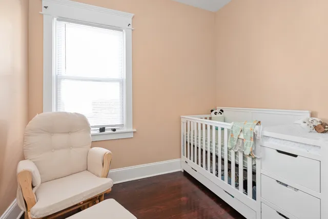 a bedroom with furniture and a window