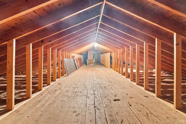 a view of balcony with wooden floor and fence