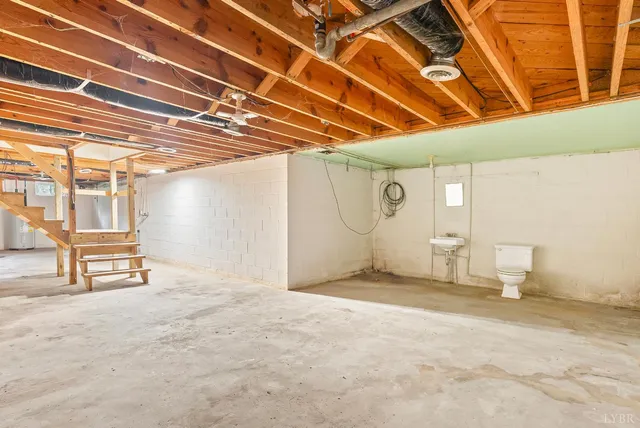 a view of a room with table and chairs