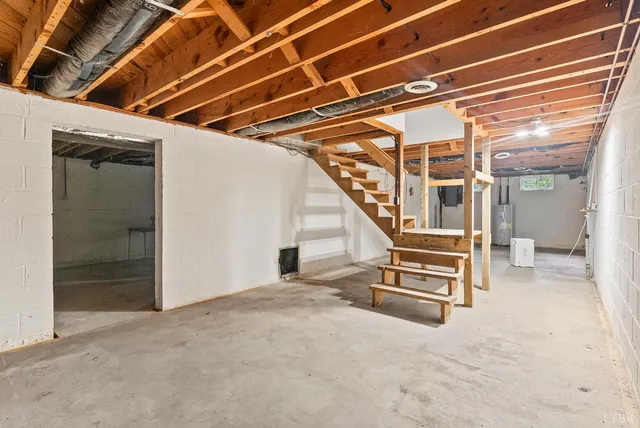a view of an empty room with stairs