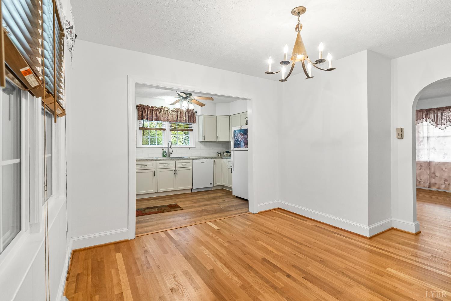 302 Henry Street Gretna, VA 24557 - Photo 3 of 49 a view of a kitchen with wooden floor and a kitchen