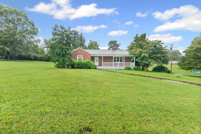 a view of a house with a big yard
