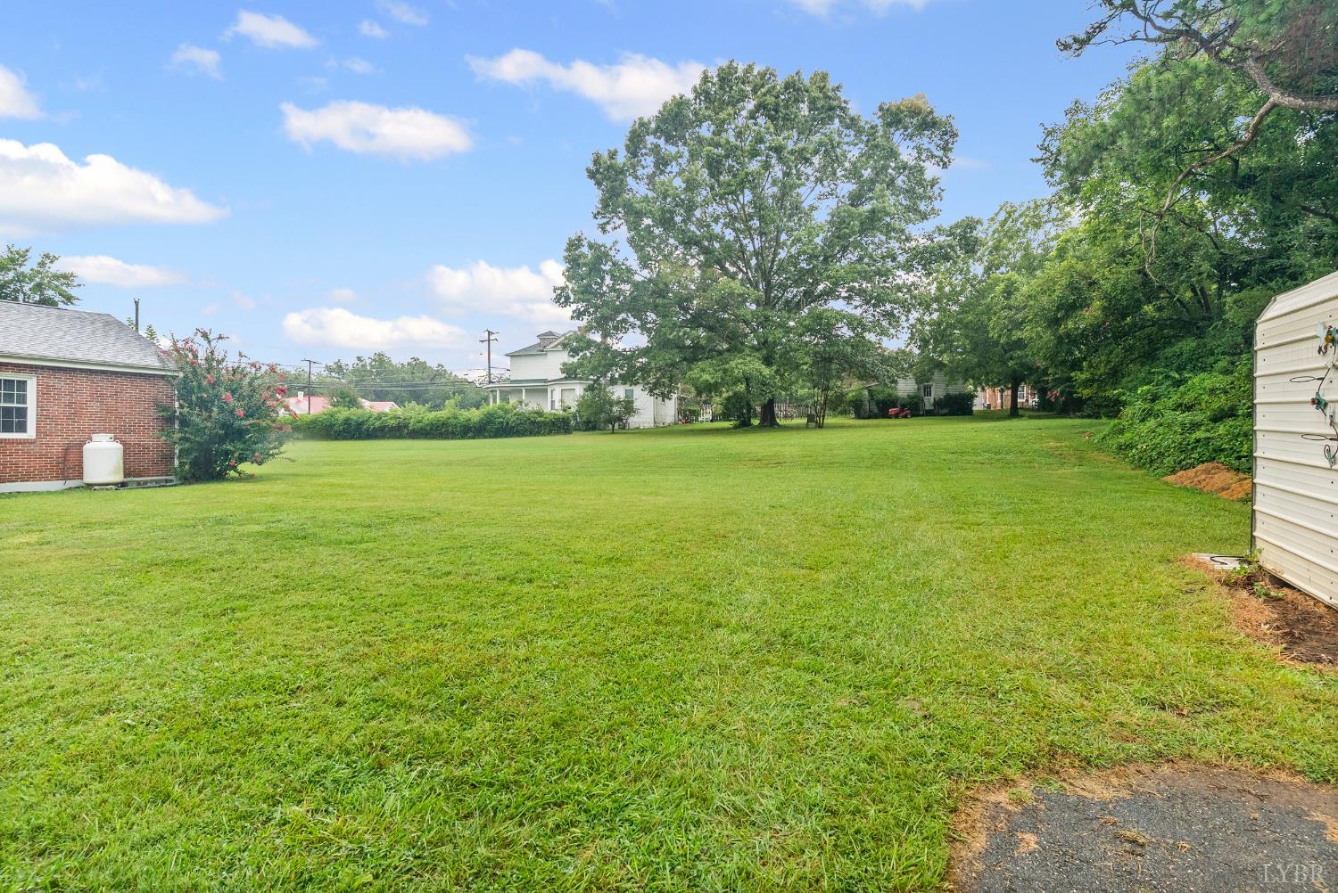 302 Henry Street Gretna, VA 24557 - Photo 38 of 49 a view of a grassy field with trees