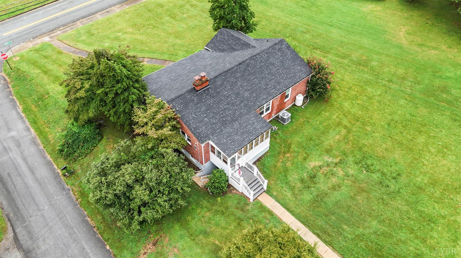 302 Henry Street Gretna, VA 24557 - Photo 41 of 49 a aerial view of a house with a yard and large trees