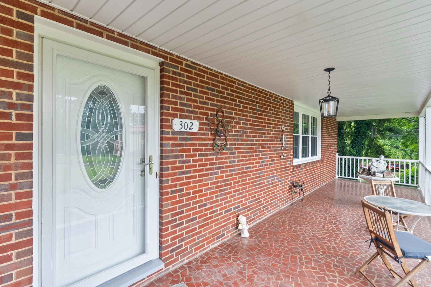 302 Henry Street Gretna, VA 24557 - Photo 5 of 49 a front view of a house with garden