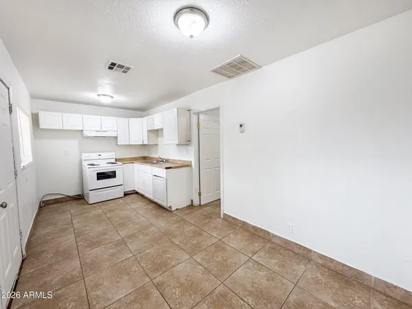 a view of a kitchen with a sink cabinets and a window