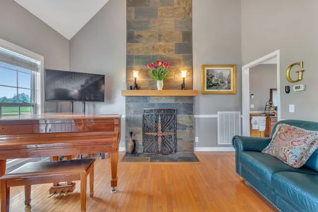 a living room with furniture and a fireplace