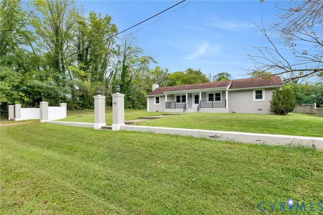 a view of house with a garden