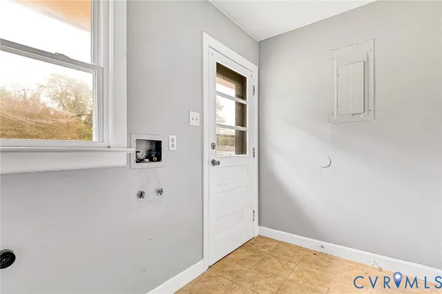 a view of an entryway with wooden floor