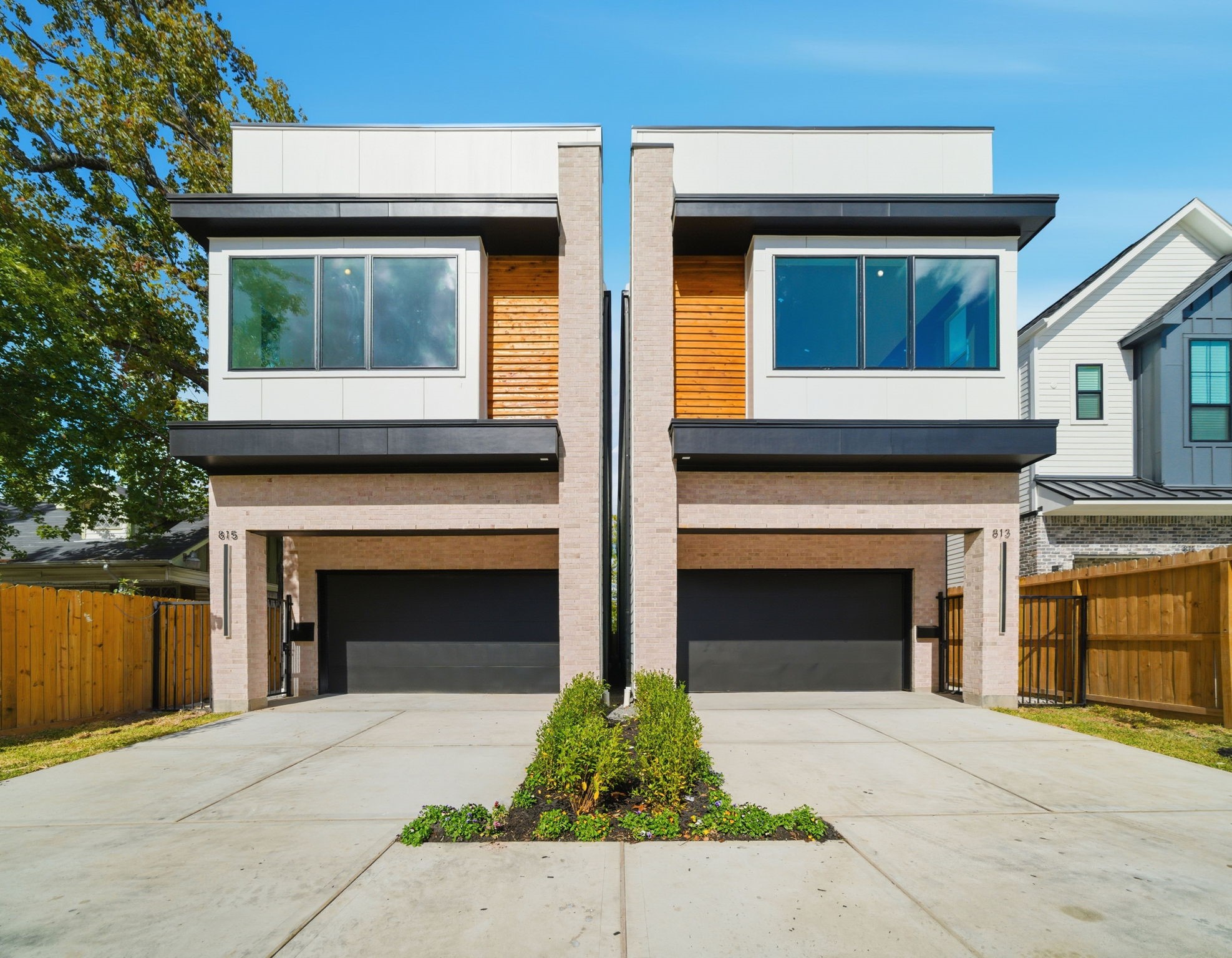 1229 Prince Street Houston, TX 77008 - Photo 1 of 32 Sleek contemporary design with brick and wood accents, oversized windows, and elevated finishes, this stylish 3-bedroom, 2.5 bath new construction home in the Heights features an amazing oversized 25ft x 131ft lot!