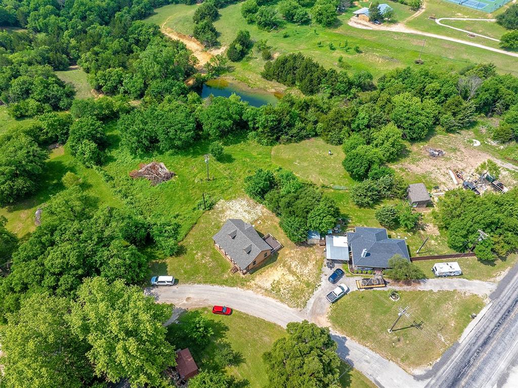 371 Spring Street Forestburg, TX 76239 - Photo 29 of 38 an aerial view of residential house with outdoor space and swimming pool