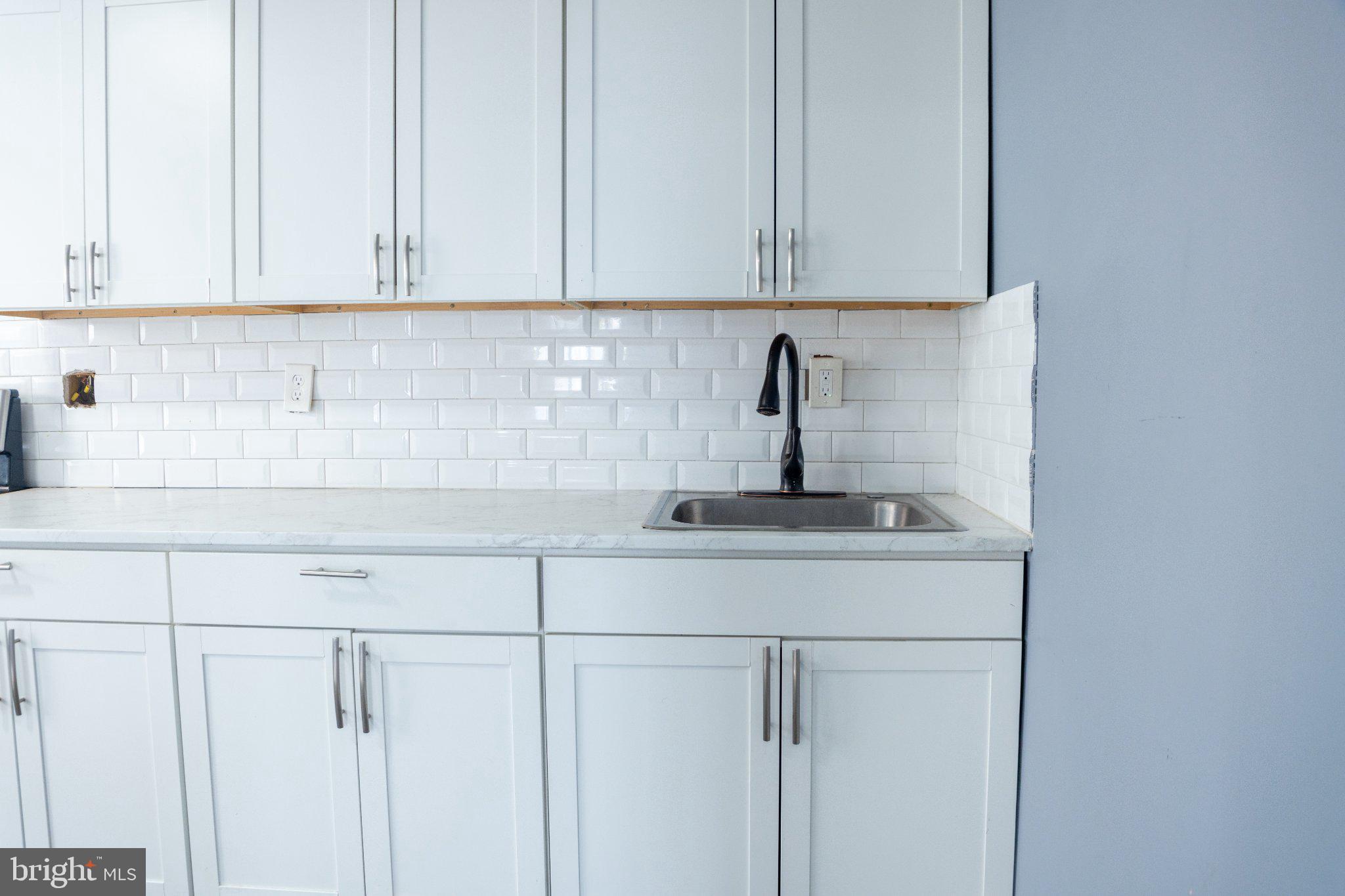 4844 North Front Street Philadelphia, PA 19120 - Photo 9 of 33 Sleek kitchen with modern finishes.