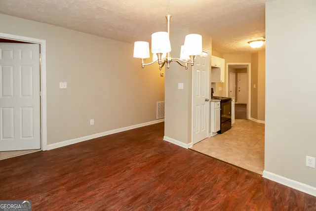 a view of a kitchen with wooden floor