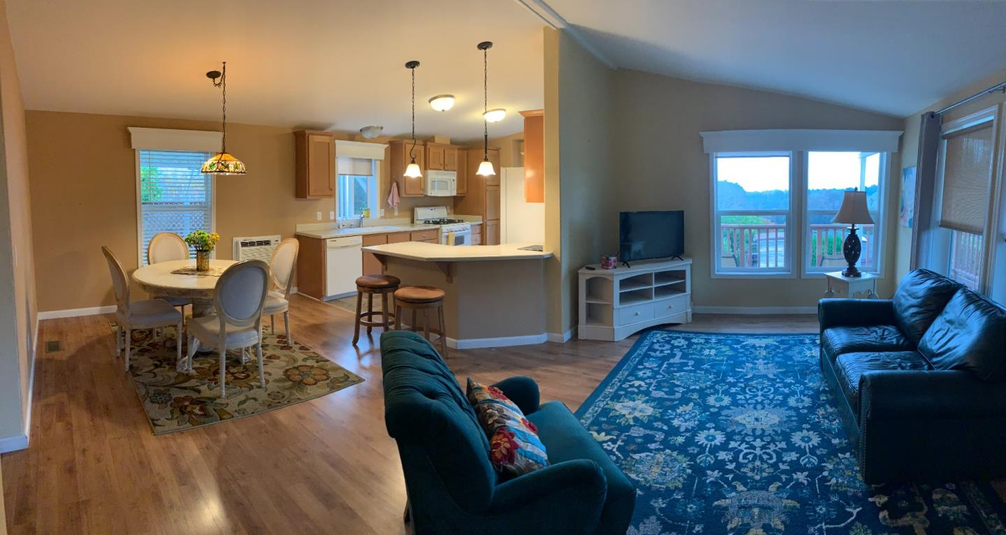 270 Hames Road, Unit 55 Watsonville, CA 95076 - Photo 13 of 53 a living room with fireplace furniture and a wooden floor