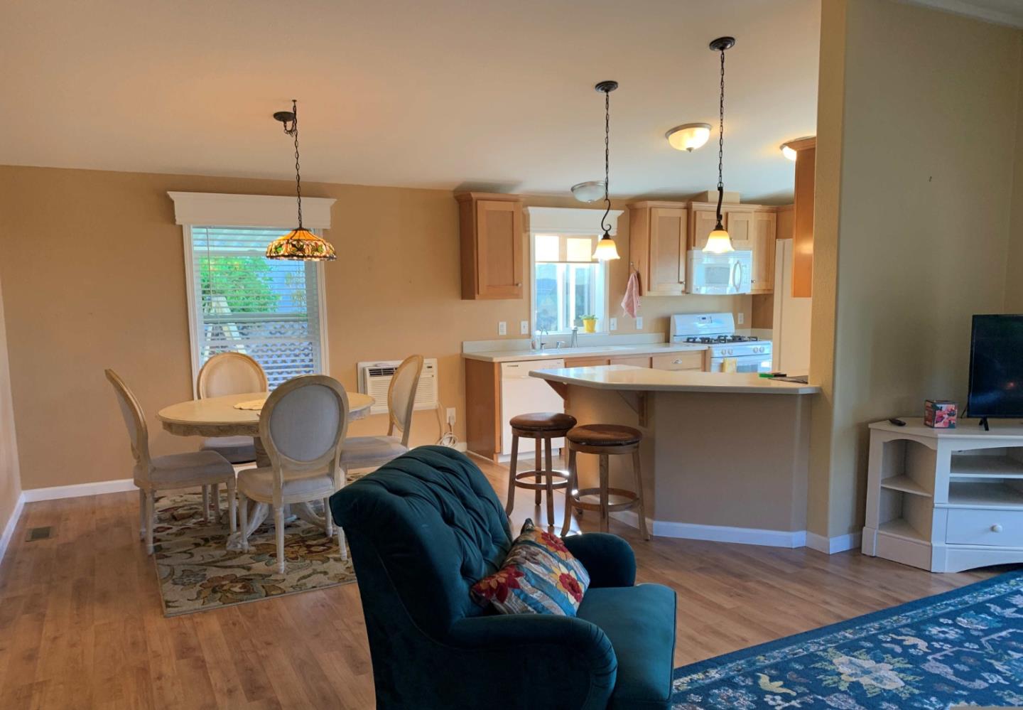 270 Hames Road, Unit 55 Watsonville, CA 95076 - Photo 15 of 53 a dining room filled chandelier and wooden floor