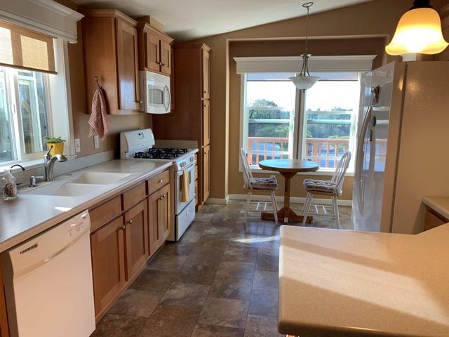 a kitchen with sink cabinets and outdoor view