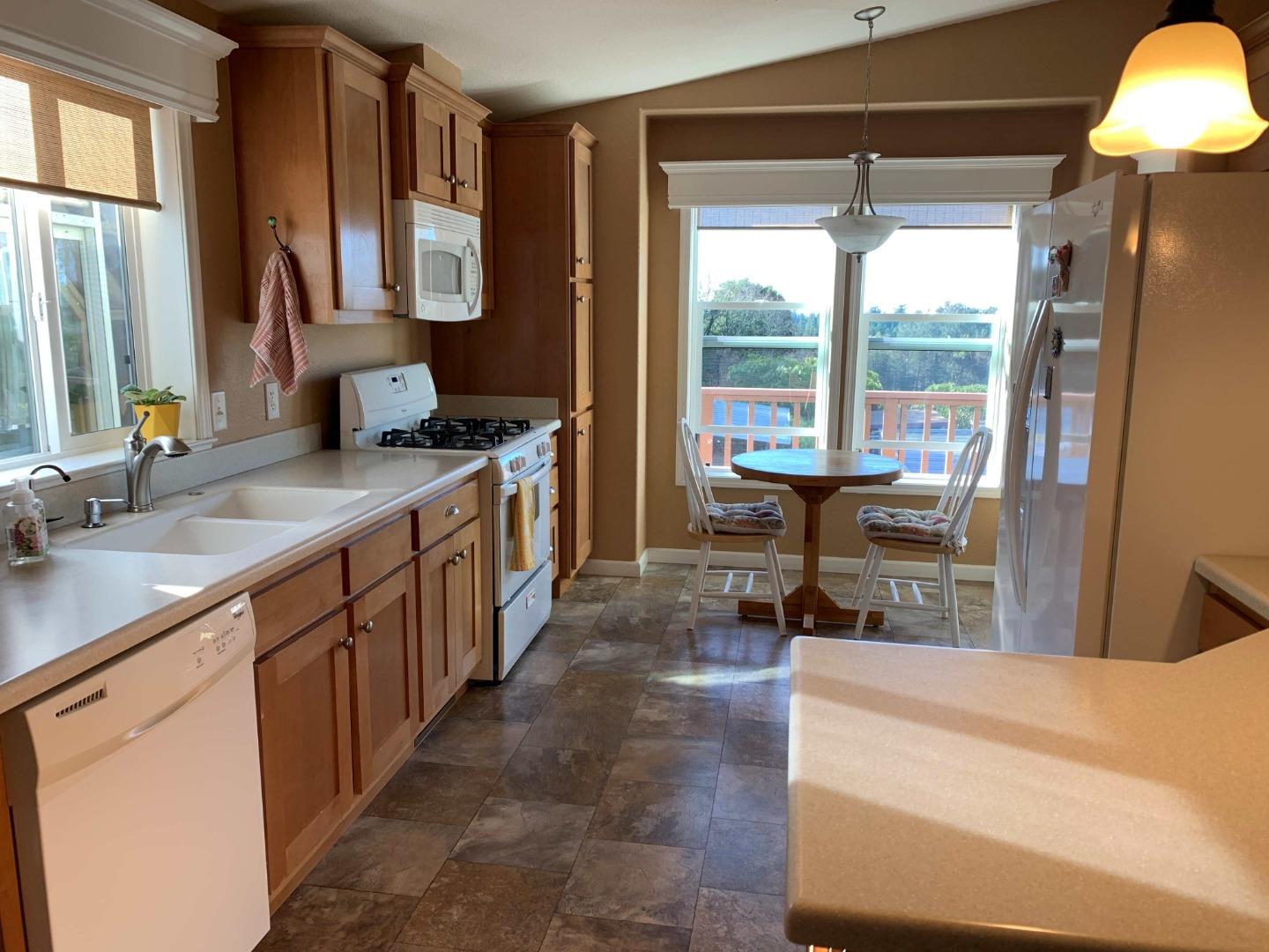 270 Hames Road, Unit 55 Watsonville, CA 95076 - Photo 17 of 53 a kitchen with sink cabinets and outdoor view