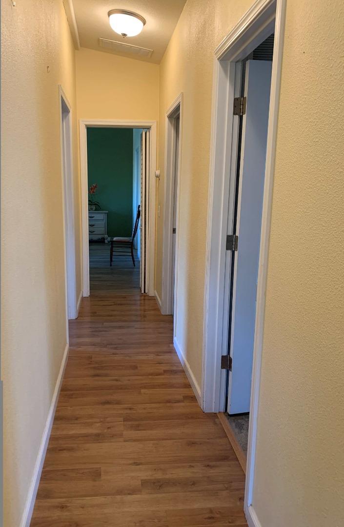 270 Hames Road, Unit 55 Watsonville, CA 95076 - Photo 22 of 53 a view of a hallway with wooden floor and staircase