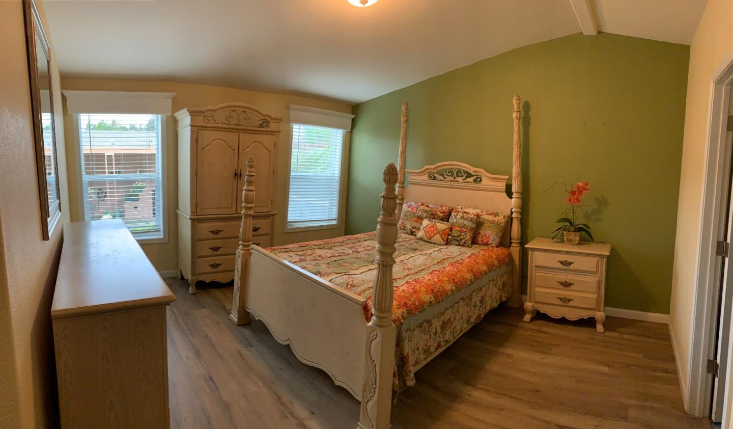 270 Hames Road, Unit 55 Watsonville, CA 95076 - Photo 27 of 53 a bedroom with a bed and wooden floor