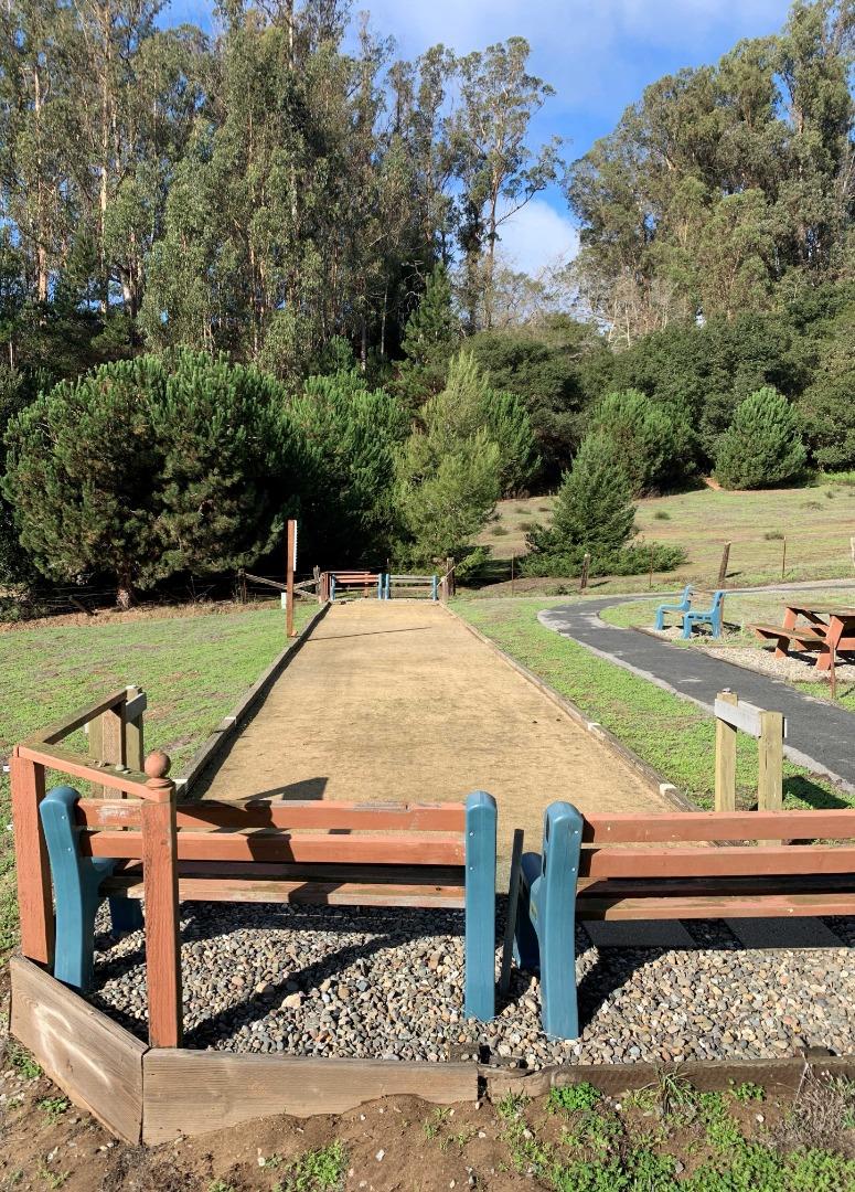 270 Hames Road, Unit 55 Watsonville, CA 95076 - Photo 36 of 53 a view of a wooden deck with chairs and a yard