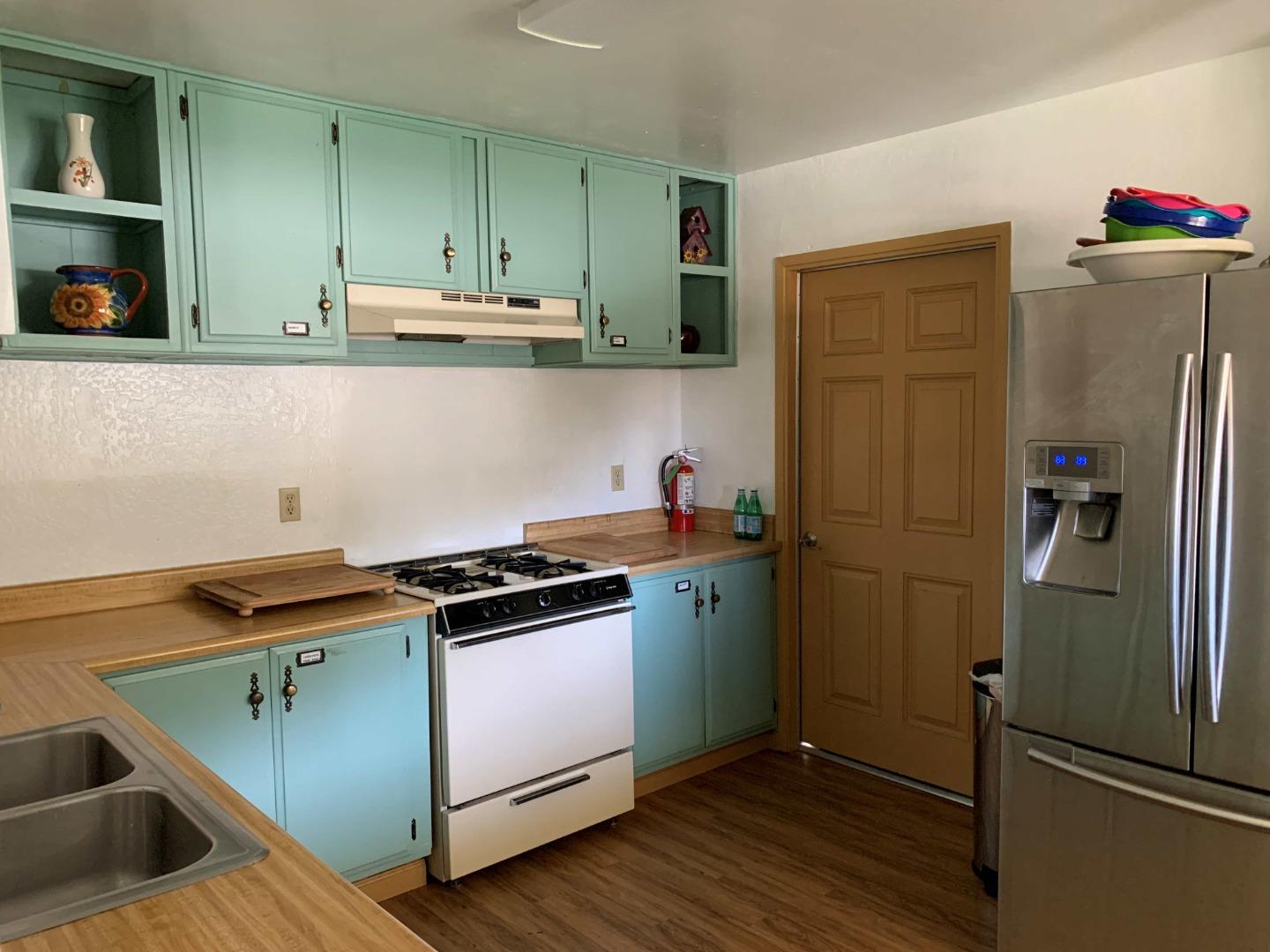 270 Hames Road, Unit 55 Watsonville, CA 95076 - Photo 46 of 53 a kitchen with stainless steel appliances granite countertop a refrigerator and a stove