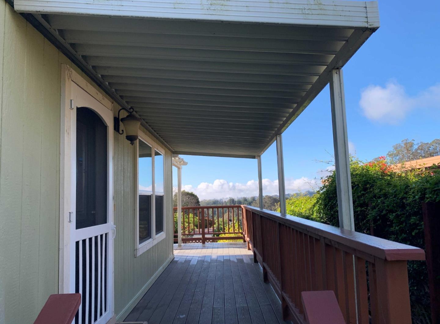 270 Hames Road, Unit 55 Watsonville, CA 95076 - Photo 9 of 53 a view of a porch with wooden floor and outdoor seating