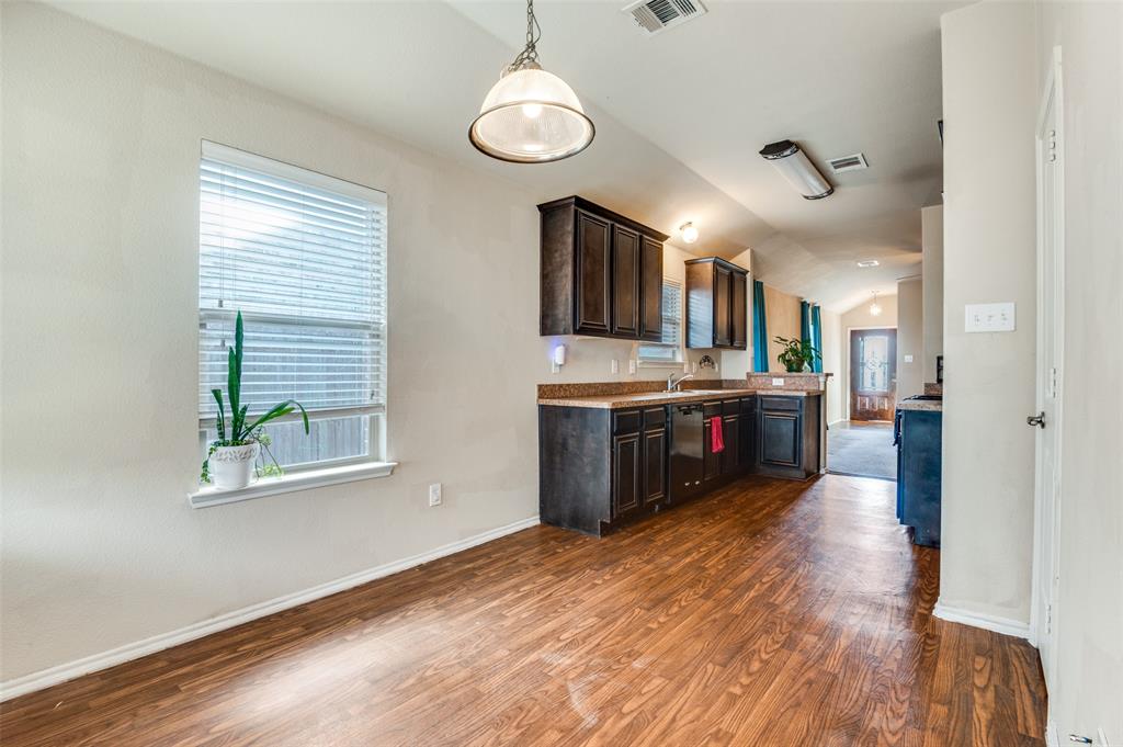 4040 Golden Rod Drive Forney, TX 75126 - Photo 12 of 25 a large kitchen with stainless steel appliances kitchen island a large counter space a sink and appliances