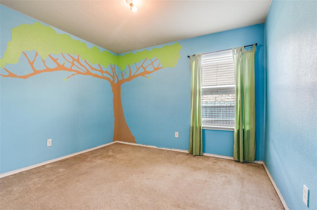 4040 Golden Rod Drive Forney, TX 75126 - Photo 14 of 25 an empty room with windows and closet