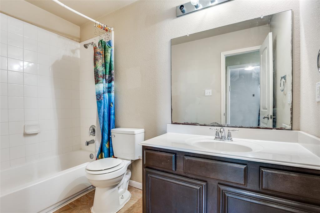 4040 Golden Rod Drive Forney, TX 75126 - Photo 18 of 25 a bathroom with a sink a toilet and shower